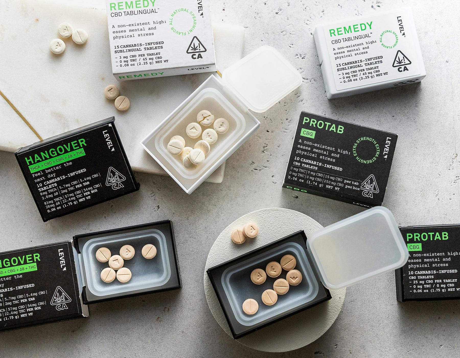 LEVEL tablets are open and spread out on a table. These are an example of products containing rare or alternative cannabinoids in various ratios for tailored effects. Available at Sol de Mendocino.