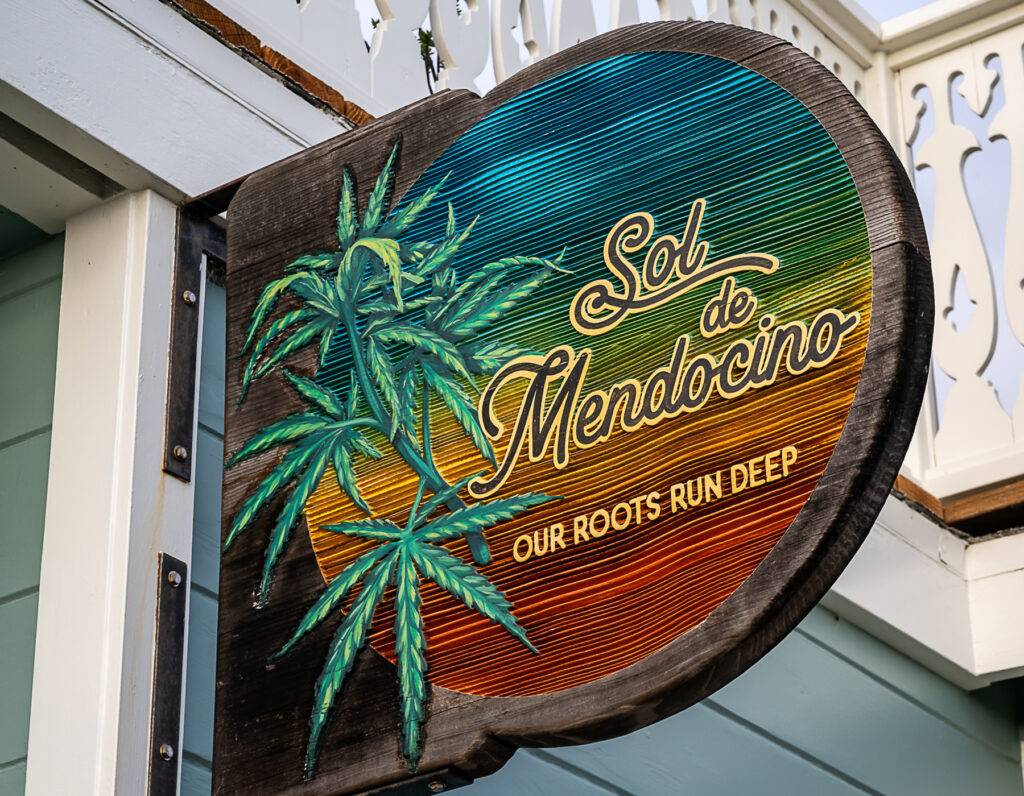 Sol de Mendocino dispensary's colorful wooden sign.